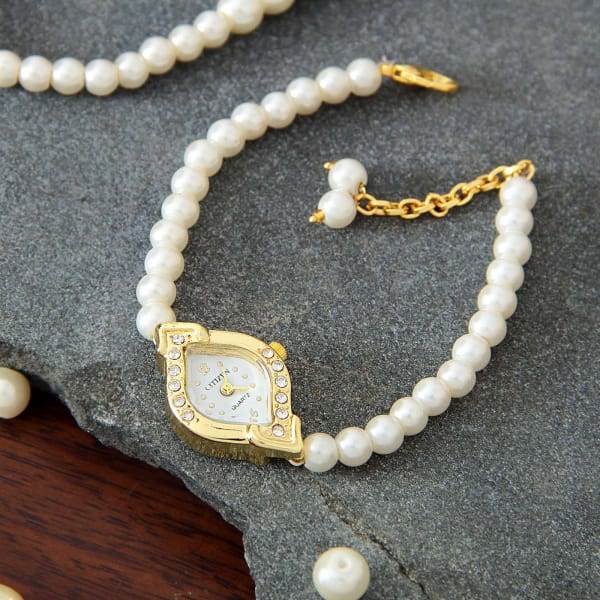 perfect party wear watch in golden and ivory white